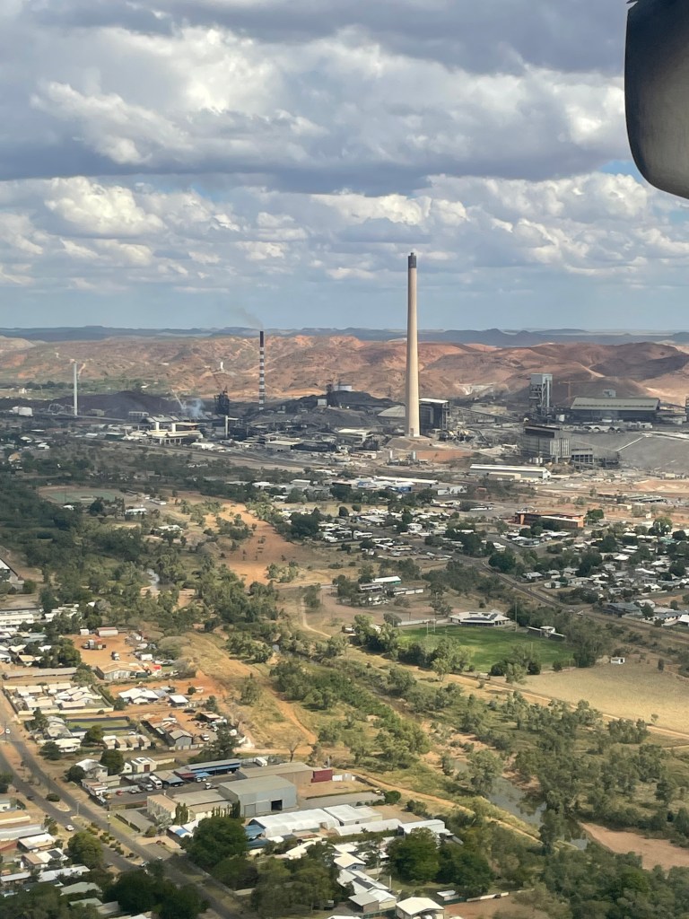 Mount Isa and mine with mountain ranges in the background.